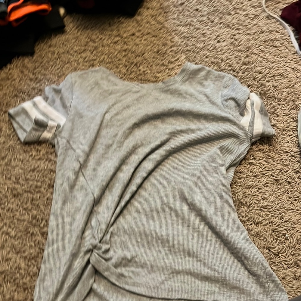 gray varsity shirt.